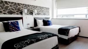 Postel nebo postele na pokoji v ubytování Hotel Black Boutique
