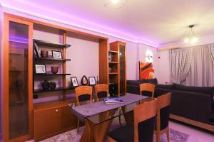 a living room with a table and a couch at City center apartment in Nafpaktos +11 photos
