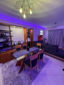 a living room with a table and a couch at City center apartment in Nafpaktos
