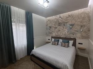 Postel nebo postele na pokoji v ubytování Le terme alloggio turistico