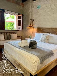 Postel nebo postele na pokoji v ubytování Mentto Hotel