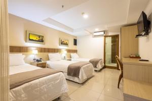 Postel nebo postele na pokoji v ubytování Bella Vista Hotel - Encarnación