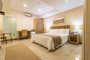 Rúm í herbergi á Bella Vista Hotel - Encarnación