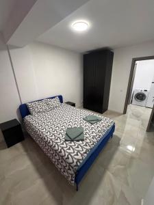 a bedroom with a bed in a room at Everest 33 Ap 4 in Bucharest