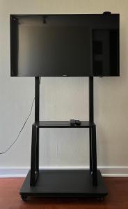 a flat screen tv sitting on a stand at Depto Boulevard del Sol II in Viña del Mar