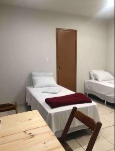 Postel nebo postele na pokoji v ubytování Suíte 301 - Pousada no Centro do Rio