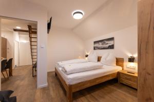 Letto o letti in una camera di Appartements Stuhleckblick