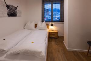 Letto o letti in una camera di Appartements Stuhleckblick