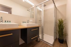 Koupelna v ubytování Appartements Stuhleckblick + 25 fotografií