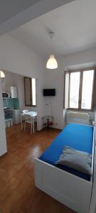 a bedroom with a blue bed in a room at La Casa di Nonna Rosa in Rome +19 photos