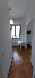 a room with a table and a bench in it at La Casa di Nonna Rosa in Rome