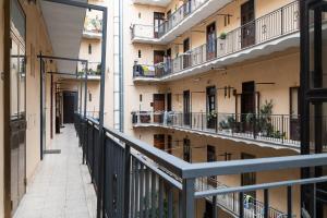 an empty corridor of an apartment building with balconies at A Casa Lamperini 59 in Rome