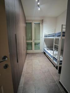 a hallway with two bunk beds in a room at Villa Garda Relax in Manerba del Garda +8 photos
