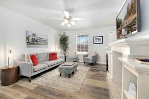 a living room with a couch and two chairs at Campus Corner-1 Mi to UofA- 1 Mi to Downtown in Fayetteville