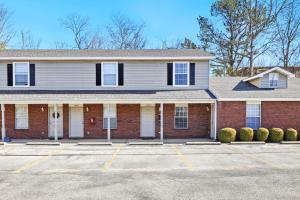 a house with a parking lot in front of it at Campus Corner-1 Mi to UofA- 1 Mi to Downtown in Fayetteville