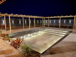 a patio at night with lights on it at Recanto Diamantino in Morro do Chapéu