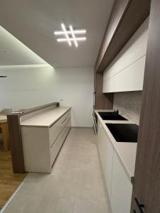 Kuchyň nebo kuchyňský kout v ubytování Apartman Akademska Četvrt