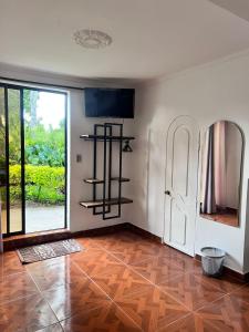 TV a/nebo společenská místnost v ubytování Hotel Campestre Nogal de Cafetal