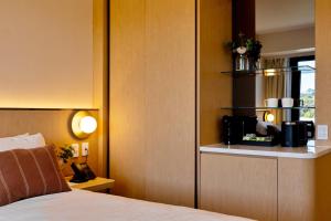Postel nebo postele na pokoji v ubytování Maxim Hotel - Auckland
