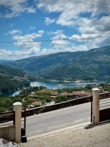 a road with a view of a river and mountains at Casa Pereira in Geres
