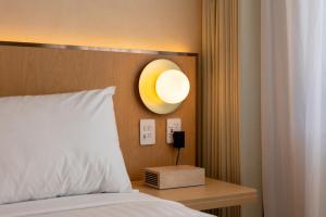 Postel nebo postele na pokoji v ubytování Maxim Hotel - Auckland