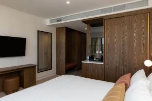 Postel nebo postele na pokoji v ubytování Maxim Hotel - Auckland