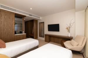 Postel nebo postele na pokoji v ubytování Maxim Hotel - Auckland