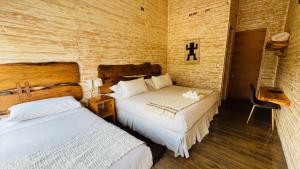 Postel nebo postele na pokoji v ubytování Hotel Arrebol