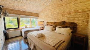 Postel nebo postele na pokoji v ubytování Hotel Arrebol