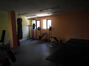 an empty room with a gym with boxing equipment at Guest House Olimpiya in Sveti Vlas