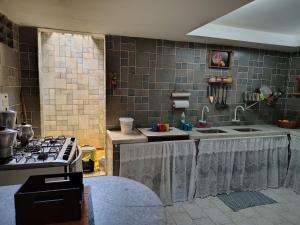 Eldhús eða eldhúskrókur á Quarto com 3 camas