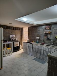 Eldhús eða eldhúskrókur á Quarto com 3 camas