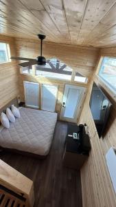 an overhead view of a bedroom in a tiny house at 060A Brand New Cozy Cabin with Loft & King bed near Grand Canyon South Rim in Valle