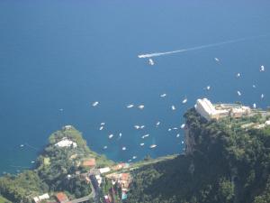 a group of boats floating in the water on a mountain at Luna D'Agerola in Agerola
