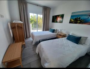 a hotel room with two beds and a window at Finca de Luna in La Orotava +57 photos