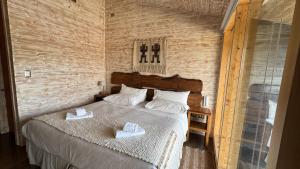 Postel nebo postele na pokoji v ubytování Hotel Arrebol