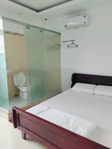 Postel nebo postele na pokoji v ubytování Nhà nghỉ Mai Lan