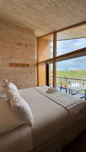 Postel nebo postele na pokoji v ubytování Hotel Arrebol