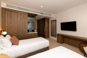 TV a/nebo společenská místnost v ubytování Maxim Hotel - Auckland