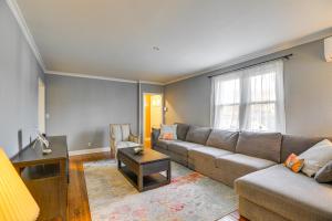 a living room with a couch and a table at 3 Mi to Downtown Spacious White Plains Home in White Plains