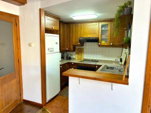 Kuchyň nebo kuchyňský kout v ubytování Apartament encantador, familiar i lluminós by RURAL D'ÀNEU
