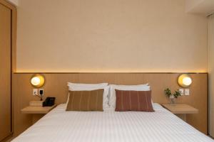 Postel nebo postele na pokoji v ubytování Maxim Hotel - Auckland