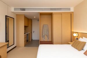 Postel nebo postele na pokoji v ubytování Maxim Hotel - Auckland