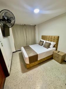 Postel nebo postele na pokoji v ubytování Hotel Pereira Central