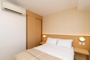 Postel nebo postele na pokoji v ubytování Maxim Hotel - Auckland