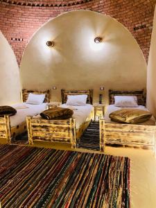 Postel nebo postele na pokoji v ubytování Shasha Ecolodge