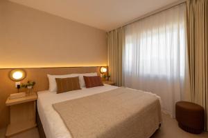 Postel nebo postele na pokoji v ubytování Maxim Hotel - Auckland