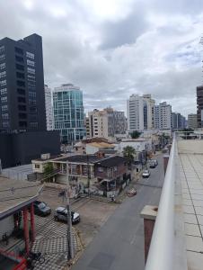a view of a city with buildings and a street at AP Itajaí in Itajaí