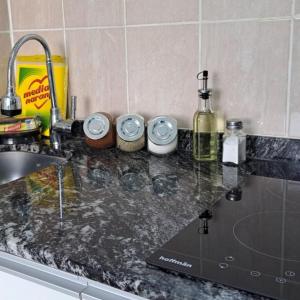 a kitchen counter top with a sink and a counter top at Monoambiente Neli in Villa Pehuenia