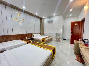 Postel nebo postele na pokoji v ubytování Khách Sạn Thiên Mỹ